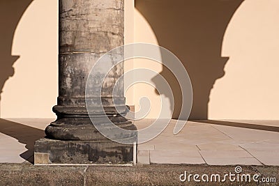 Close-up of single stone corinthian column and portico with blank wall Stock Photo