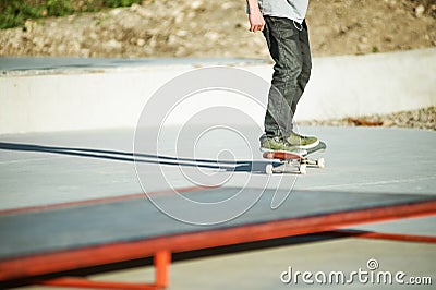 Close-up Skateboarder`s legs skateboard on concrete. Skating On skateboard popular youth extreme sports Stock Photo