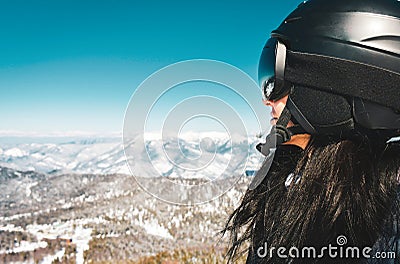 Close up skier snowboarder female person portrait with goggles look out to mountains panorama reflection. Ski holiday in Georgia Stock Photo