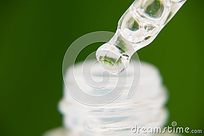 Close up skin care that is useful for moisturizing and brightening facial skin on blur green grass background, soft Stock Photo