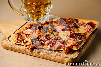 Close-up of slice of delicious homemade pizza served with light Stock Photo