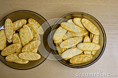 Close-up of small cookies, top view, macro, loaf-shaped in two glass vases Stock Photo