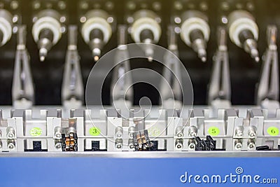 Close up small electric transformer at high precision and accuracy of multiple automatic coil winding machine Stock Photo
