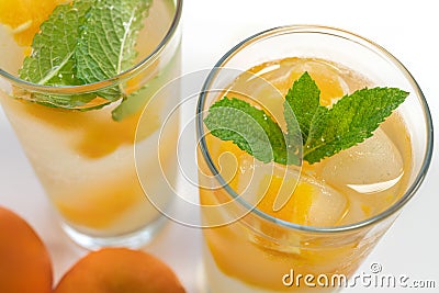 Orange Fruit Frozen in Ice Cubes, White Background Stock Photo