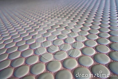 Close up of small round tile in perspective Stock Photo