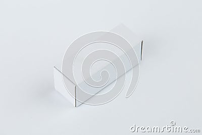 Close up of a small white cardboard box , isolated on white background Stock Photo