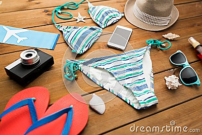 Close up of smartphone and beach stuff Stock Photo