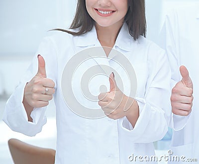 Close up. smiling doctor therapist showing thumbs up Stock Photo