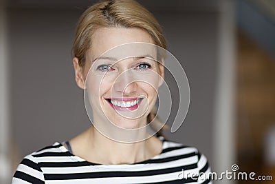 Close up Of A Smiling Italian blond woman Stock Photo