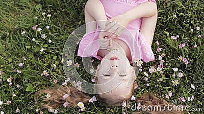 Close-up Smiling Little Cute Baby Girl Lying on Green Grass Holding Flowers Looking at Camera Stock Footage - Video of children, lying: 150804696 