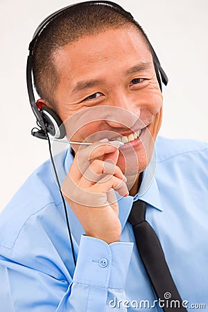 Close-up of smiling male customer service representative wearing Stock Photo