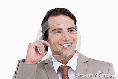 Close up of smiling salesman on his cellphone Stock Photo