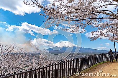 Close-up snow covered Mount Fuji Mt. Fuji with clear dark blue sky background in sakura cherry blossoms Editorial Stock Photo