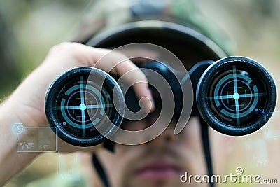 Close up of soldier or hunter with binocular Stock Photo