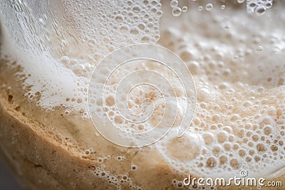 close-up of sourdough starter with flour, water, and bubbles Stock Photo