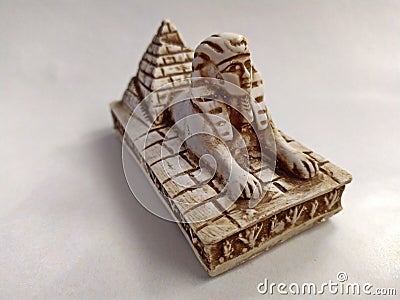 Close-up on a souvenir sphinx and pyramids from Egypt on a white background Stock Photo