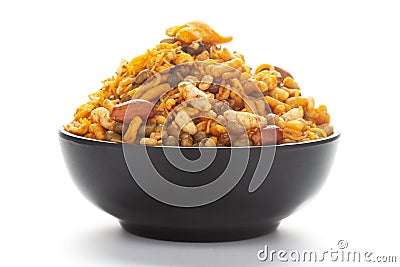 Close up of spicy Ratlami mixture Indian namkeen snacks on a ceramic black bowl. Stock Photo