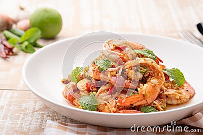 Close up Spicy salad with shrimp.Thai style prawn salad with lemongrass shallot mint mixed with Chili Paste and lime sauce Stock Photo