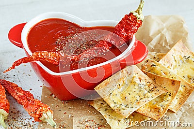 Close-up of a spicy tomato soup with chips Stock Photo