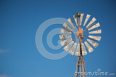 Close up Spinning Windmill on summer day Stock Photo