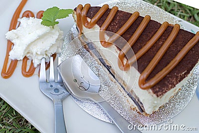 Close up spoon with banoffee cake pour caramel. Stock Photo