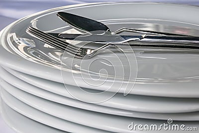 Spoon, knive, fork on plates in restaurant Stock Photo