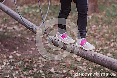 Close-up sports shoes in the adventure park Stock Photo