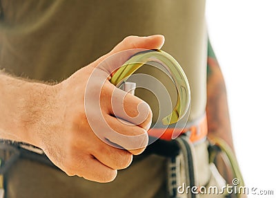 Close-up of sporty man hand with snap hook carabiner. Stock Photo