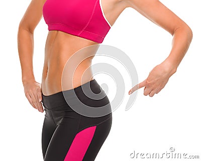 Close up of sporty woman pointing at her buttocks Stock Photo
