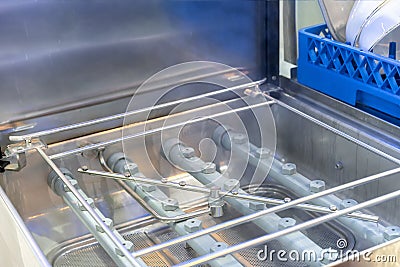 Close up spraying nozzle and detail inside of automatic dishwasher machine for industrial Stock Photo