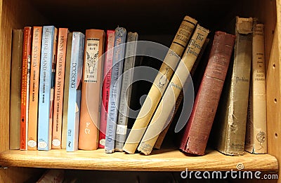 Close-up of a stack of books on a shelf Editorial Stock Photo