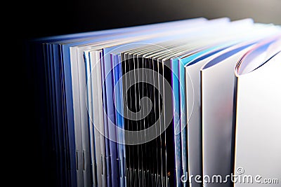 Close up of a stack of hardcover books on a black background Stock Photo