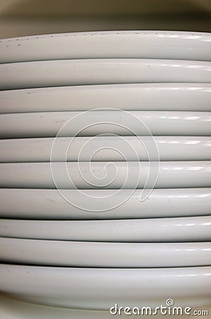 Close up of a stack of plain white plates Stock Photo