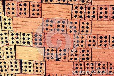 Close up of stacked clay bricks - constructional material - industrial production of bricks Stock Photo