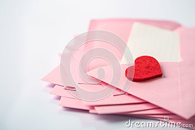 close up Stacking of pink envelopes and a mail letter paper and Stock Photo