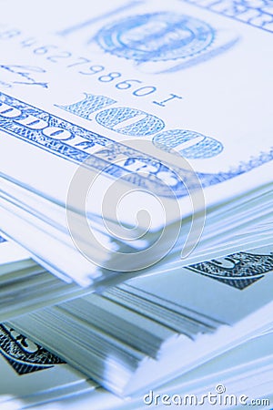 Close up of stacks of hundred US Dollar bills. Shot with shallow depth of field. Selective focus on description Stock Photo