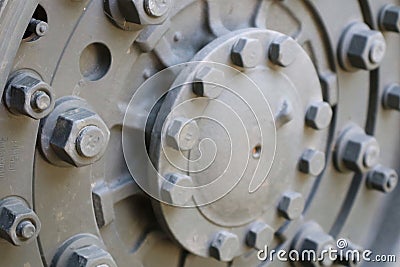 Close-up of a steel car wheel, large iron bolts, green, vintage, concept, military vehicles Stock Photo
