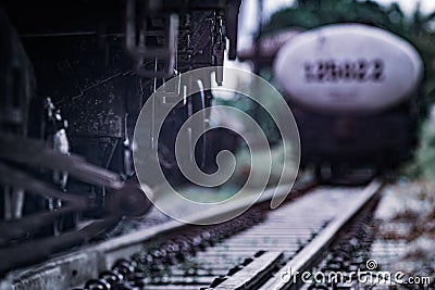 Close up Steel railroad fasteners.Iron nuts fastened to railway tracks.Rusty old iron freight train In the train station, Thai Editorial Stock Photo