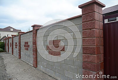 Close up on Stone, Brick, Block Fence Wall. Natural Fencing. Stock Photo