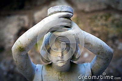 Close up of stone carved woman face of granite sculpture Stock Photo