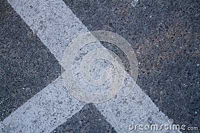 Close up of street line on grainy asphalt. Stock Photo