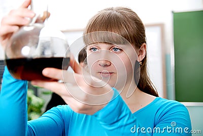 Close-up of a student performing an experiment in chemistry lab Stock Photo