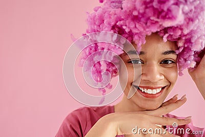 Close up studio portrait of attractive cute fun female african ethnicity with beautiful white toothed smile Stock Photo