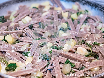Close up of the succulent and typical Italian dish Pizzoccheri. Typical dish from Valtellina, Lombardy, Italy Stock Photo