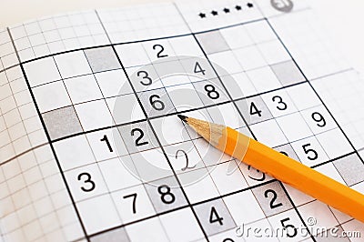 Close up of sudoku game and yellow pencil Stock Photo