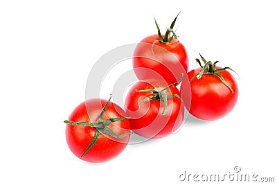 Close-up of summer harvest of bright red tomatoes with green leaves on a white background. Juicy, ripe and fresh tomatoes Stock Photo