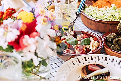 Close up of table full of fresh seasonal healthy food for group of people - lunch or brunch background coloured composition Stock Photo