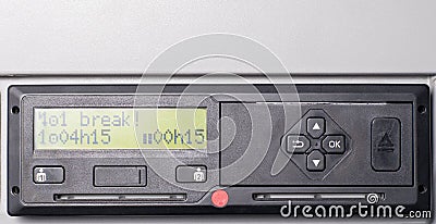 Close up of tachograph with 15 minutes of driving left warning on display. Driver is due to take 45 minutes break. Stock Photo