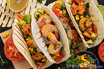 Close up tacos with shrimp. Mexican traditional snack. View from above. Stock Photo