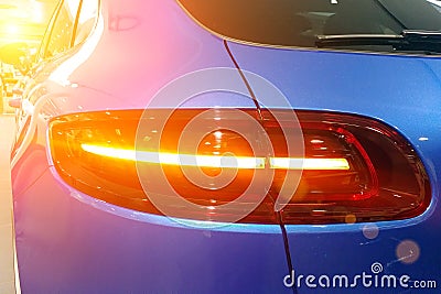 Close up of the and taillights of the premium blue SUV crossover Rear right view Stock Photo